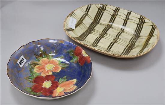 A Poole combed slipware dish and a Doulton dish